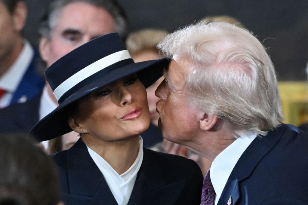 A view of Melania Trump from the side, showcasing her elegant outfit during inauguration