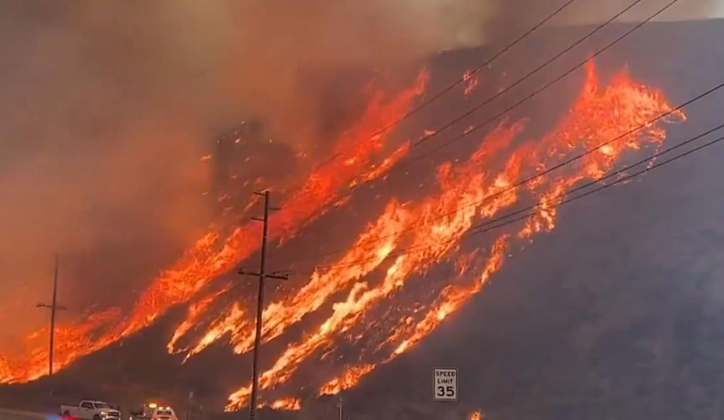 Smoke rising from the Hughes wildfire near Castaic Lake