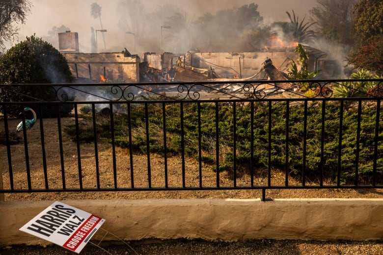 Firefighters battling the intense blaze amidst heavy winds and smoke