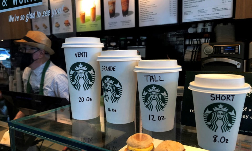 Barista serving customers at Starbucks