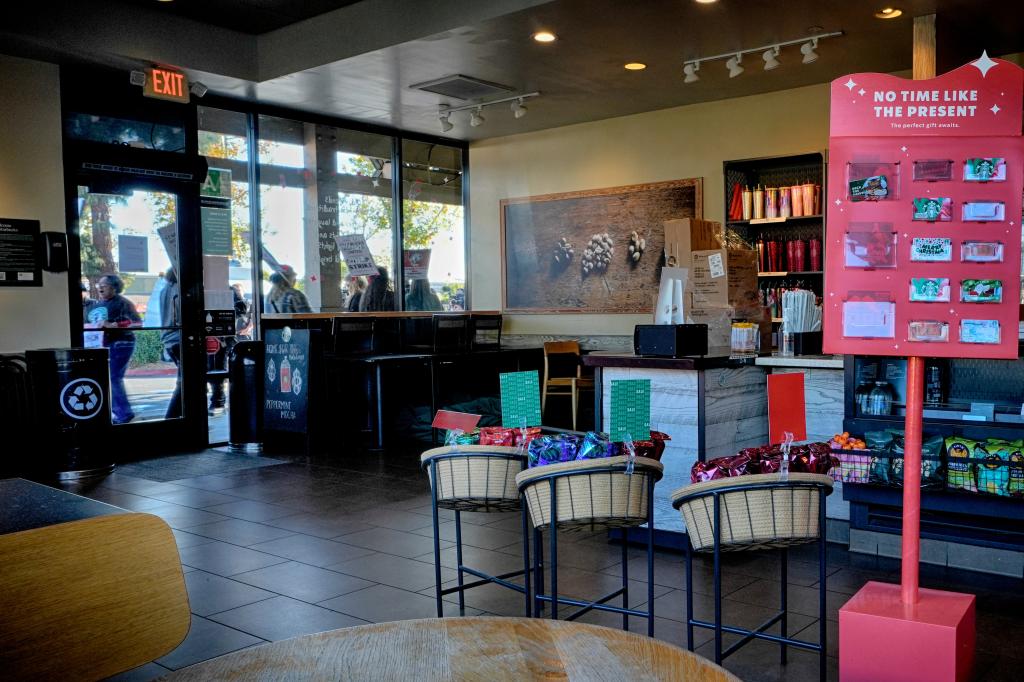 Protesting Starbucks workers holding signs demanding fair wages