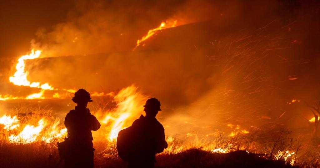 Firefighters combating the Hughes wildfire