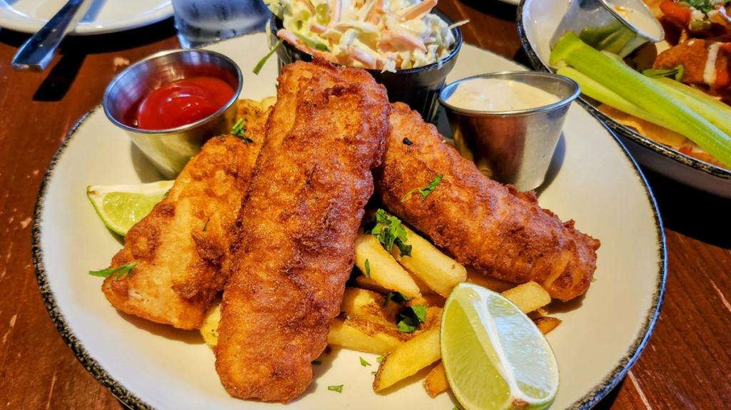 John Tinniswood enjoying his favorite dish of fish and chips