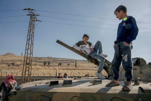 Families searching through the remnants at Saydnaya Prison