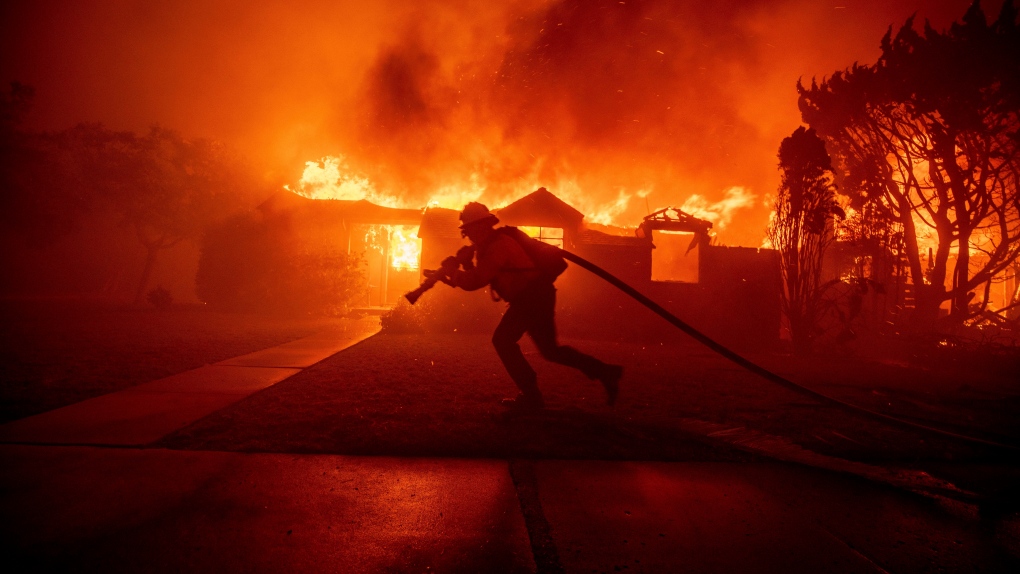 Residents evacuating from the wildfire in Pacific Palisades