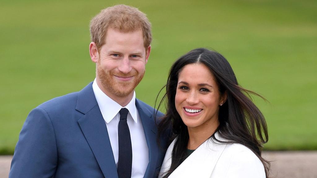 Harry and Meghan with dogs in a park