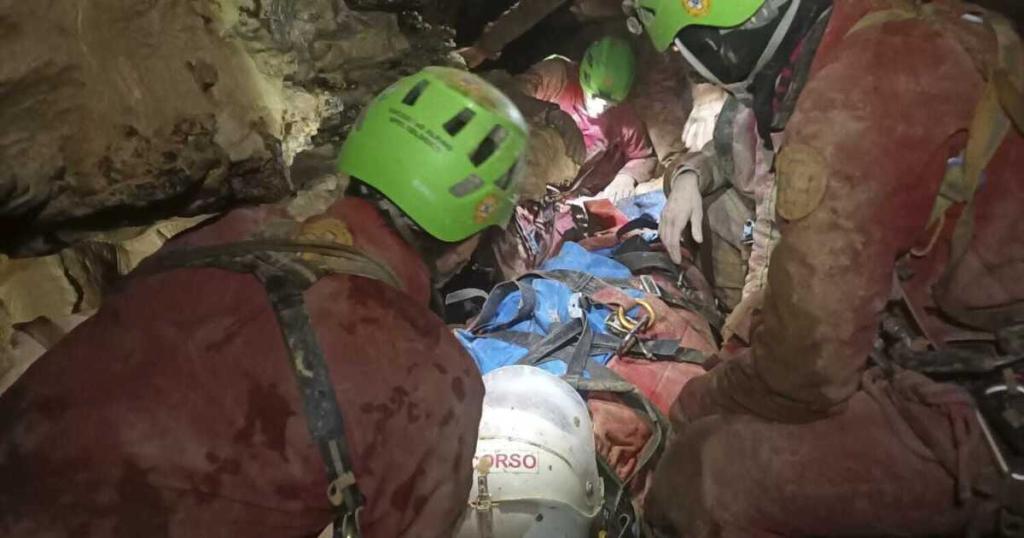 Team of rescuers coordinating efforts in the cave