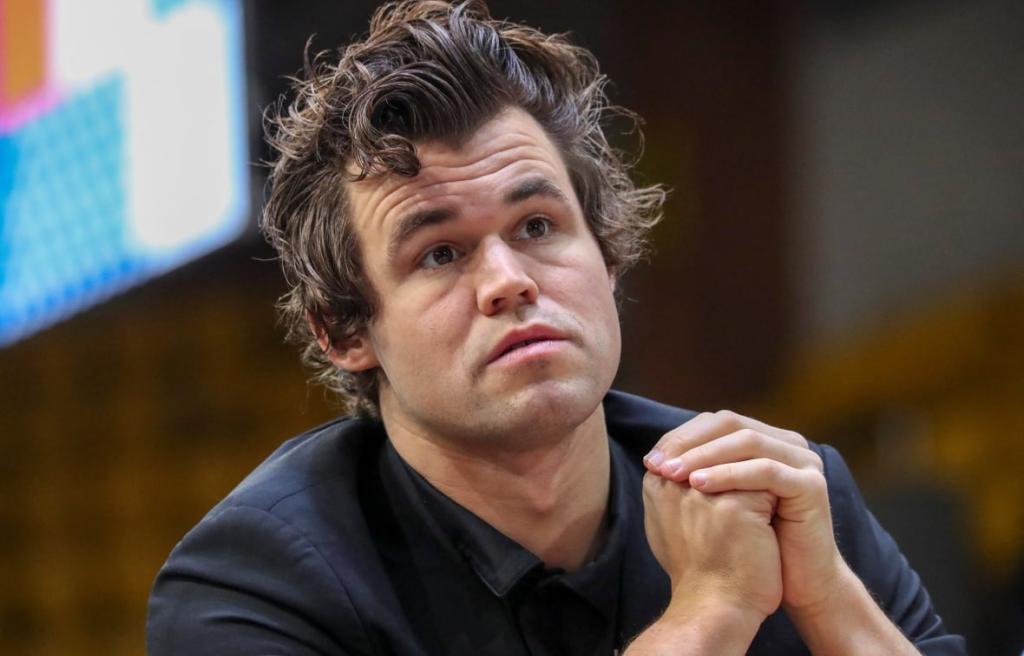 Magnus Carlsen playing chess in a friendly competition setting