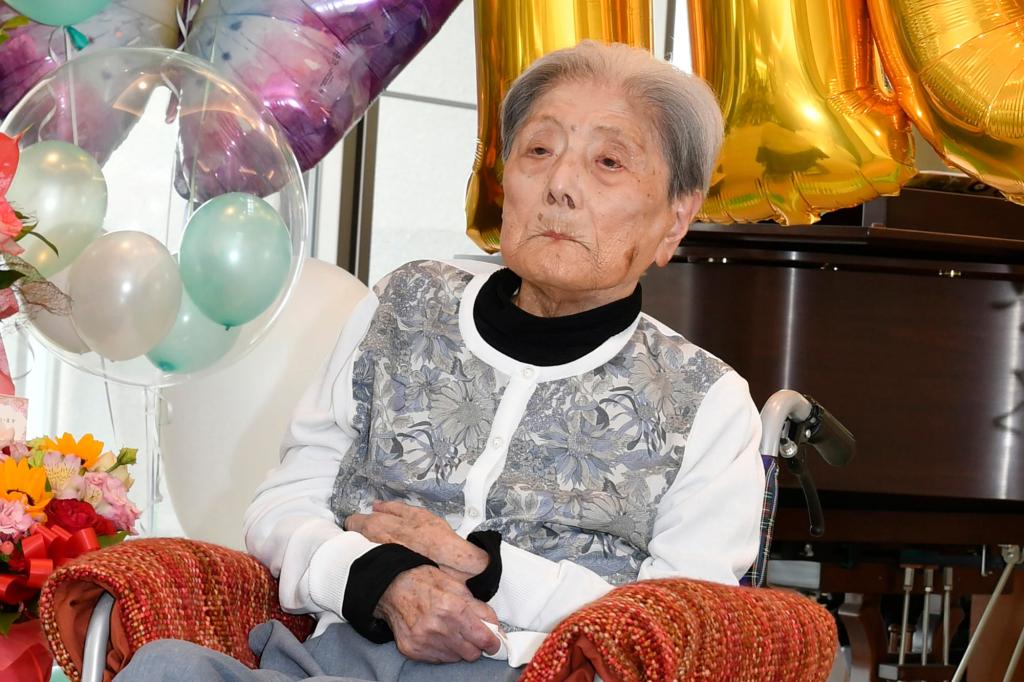 Tomiko Itooka celebrating her birthday with balloons and flowers