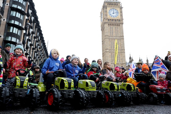 Farmers marching with tractors during the protest in London